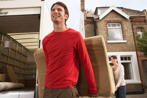 Professional movers handling office equipment during a Fulwell relocation