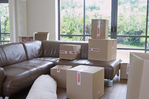 Careful wrapping of fragile household items during packing services in Fulwell